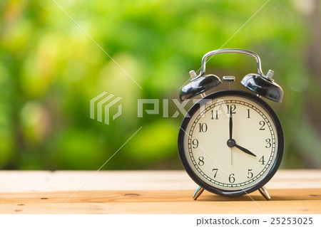 retro clock in green garden at 4 o'clock retro clock in green garden at 4 o'clock 25253025