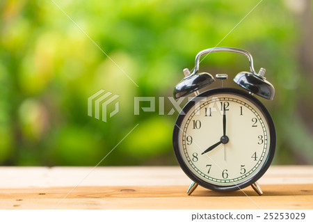 retro clock in green garden at 8 o'clock retro clock in green garden at 8 o'clock 25253029