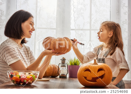 family preparing for Halloween. 25254698