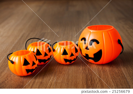 Group of happy and smiling jack-o-Lantern pumpkins Group of happy and smiling jack-o-Lantern pumpkins 25256679