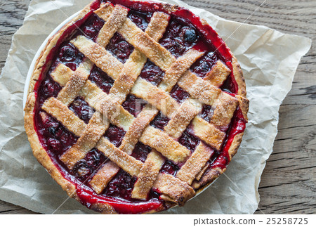 Cherry pie on the wooden background 25258725