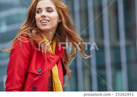 Beautiful stylish woman in a red coat. Beautiful stylish woman in a red coat. 25262951