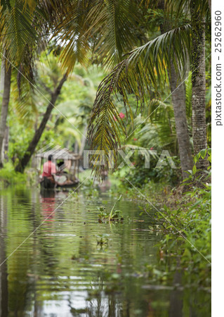 Unidentified indian people in small boat in backwa 25262960