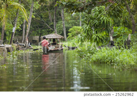 Unidentified indian people in small boat in backwa Unidentified indian people in small boat in backwa 25262962