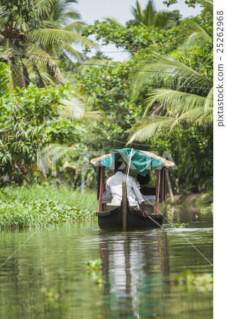 Unidentified indian people in small boat in backwa Unidentified indian people in small boat in backwa 25262968