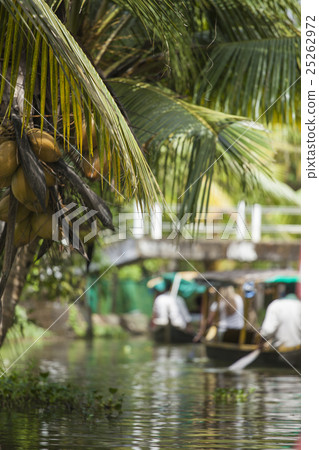 Unidentified indian people in small boat in backwa Unidentified indian people in small boat in backwa 25262972