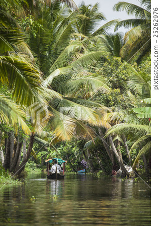 Unidentified indian people in small boat in backwa Unidentified indian people in small boat in backwa 25262976
