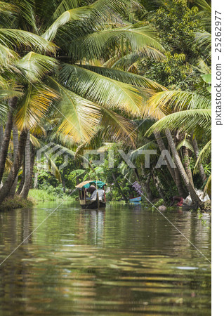 Unidentified indian people in small boat in backwa Unidentified indian people in small boat in backwa 25262977