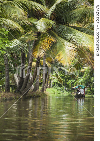 Unidentified indian people in small boat in backwa Unidentified indian people in small boat in backwa 25262978