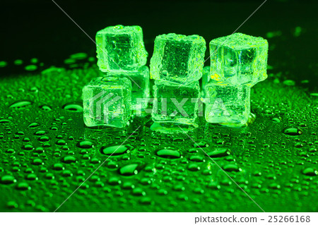 Water drop with ice cubes on lighting green Water drop with ice cubes on lighting green 25266168