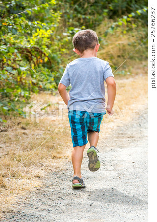 child running along a country road 25266237