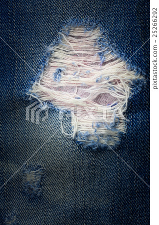 Vintage jeans torn denim texture. Vintage jeans torn denim texture. 25266292