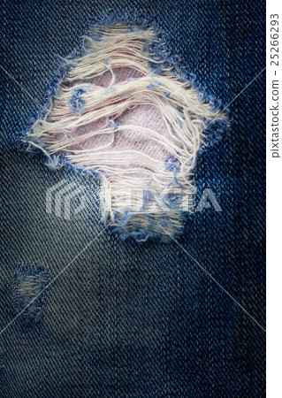 Vintage jeans torn denim texture. Vintage jeans torn denim texture. 25266293