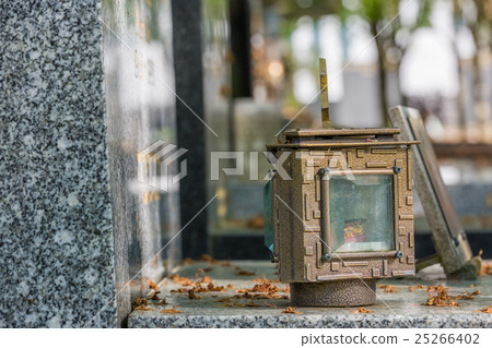 candle lantern on the stone grave 25266402
