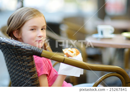 Adorable little girl playing with paper moustache 25267841