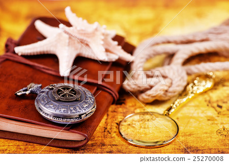 old notebook, loupe and compass on the map old notebook, loupe and compass on the map 25270008