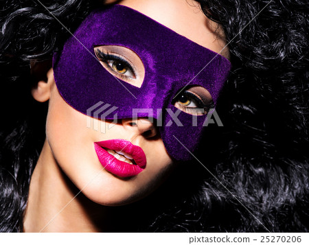 Beautiful woman with  violet theatre mask on face 25270206