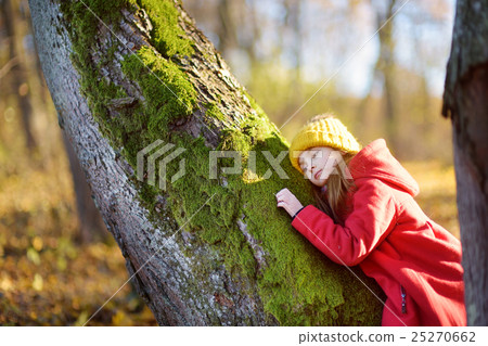 Cute girl having fun on beautiful autumn day Cute girl having fun on beautiful autumn day 25270662