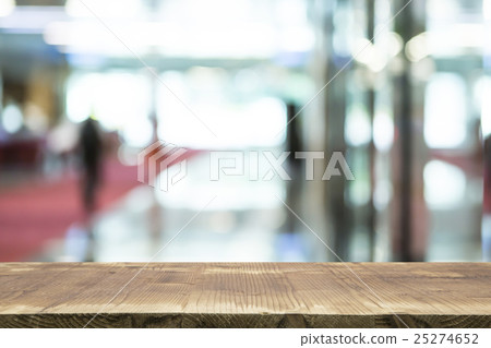 Wooden table and blurred background 25274652
