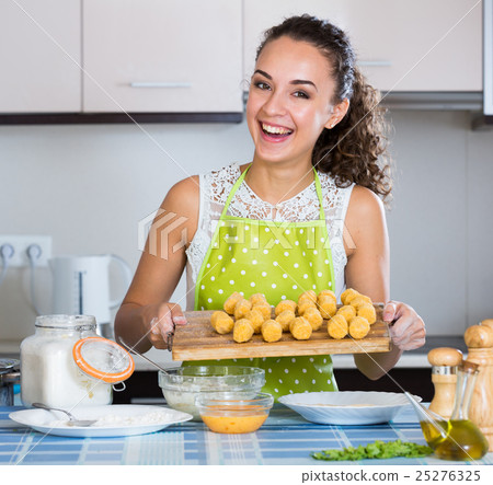 woman rolling filled croquettes woman rolling filled croquettes 25276325