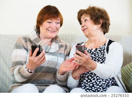 Senior women with mobile phones 25276333