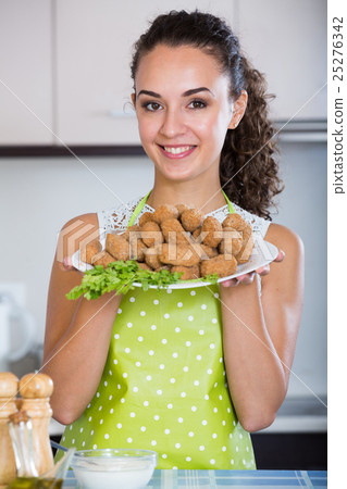 brunette with home-made croquettes brunette with home-made croquettes 25276342
