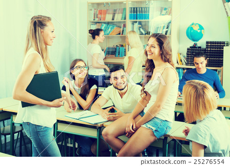 students chatting while sitting in the room students chatting while sitting in the room 25276554