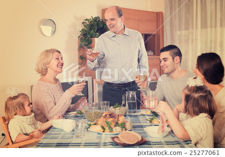 family sitting at table for dinner family sitting at table for dinner 25277061