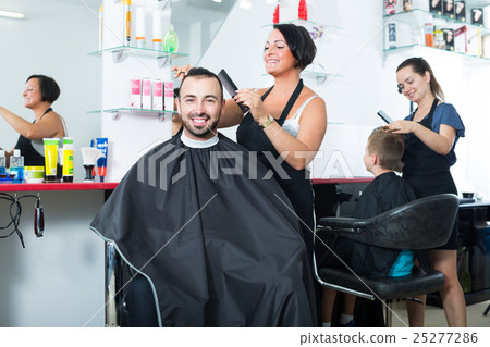 hairdresser and client in beauty salon . 25277286