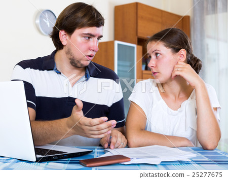 Couple sitting at desk Couple sitting at desk 25277675