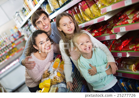 Pleasant customers with children buying food in hypermarket 25277726