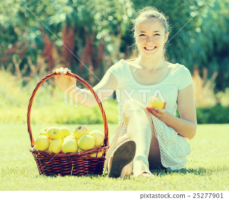 girl with apples harvest in garden girl with apples harvest in garden 25277901