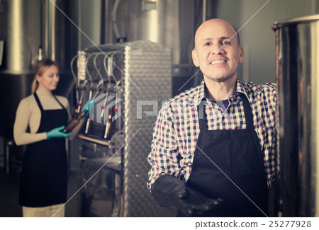 Portrait of mature friendly male brewery worker Portrait of mature friendly male brewery worker 25277928