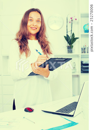 young woman employee in office. 25278006