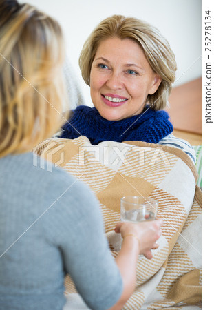 Portrait of sick female pensioner and her careful daughter Portrait of sick female pensioner and her careful daughter 25278134