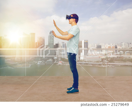 happy man in virtual reality headset or 3d glasses 25279649