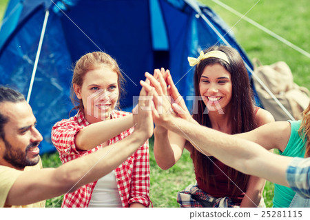 happy friends making high five at camping happy friends making high five at camping 25281115