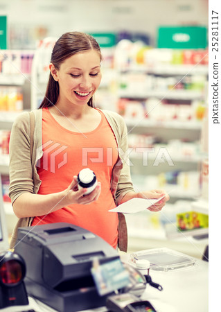 happy pregnant woman with medication at pharmacy happy pregnant woman with medication at pharmacy 25281117