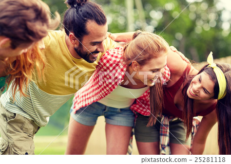 group of smiling friends outdoors group of smiling friends outdoors 25281118