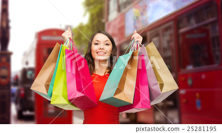 woman with shopping bags over london city street 25281195