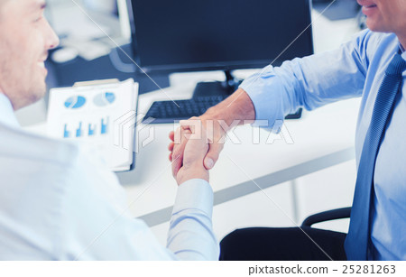 businessmen shaking hands in office 25281263