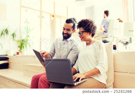 creative team with laptop and tablet pc at office 25281266