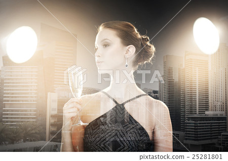 young asian woman drinking champagne at party 25281801