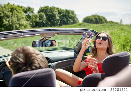 friends driving in car and blowing bubbles friends driving in car and blowing bubbles 25281831