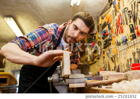 carpenter working with plane and wood at workshop carpenter working with plane and wood at workshop 25281832