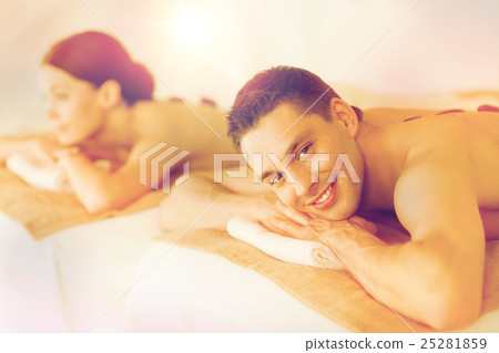 couple in spa with hot stones couple in spa with hot stones 25281859