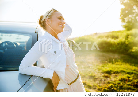 happy teenage girl or young woman near car 25281878