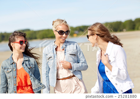 group of smiling women in sunglasses on beach group of smiling women in sunglasses on beach 25281880