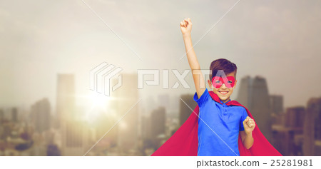boy in red superhero cape and mask showing fists 25281981