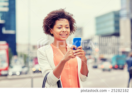happy african businesswoman with smartphone happy african businesswoman with smartphone 25282182